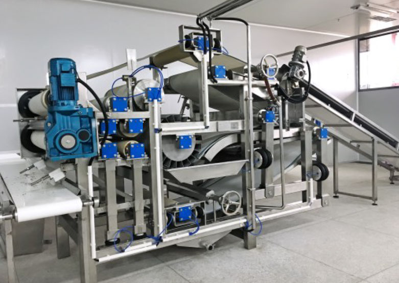Equipos de precocinado y exprimido en cinta